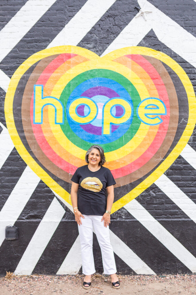 Dr. Safavi in front of Hope mural