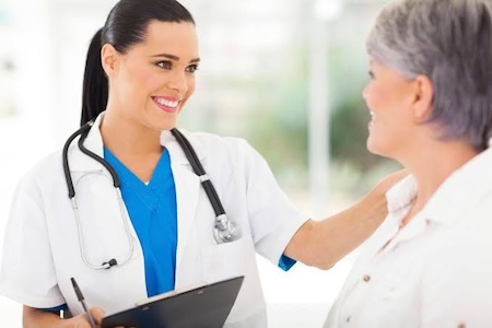 dentist speaking with patient